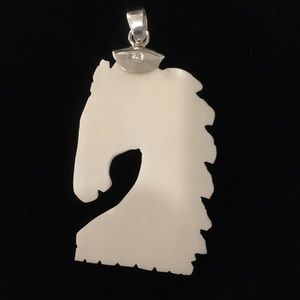 Bali goddess carved bone horse pendant in sterling silver. Has protective bag